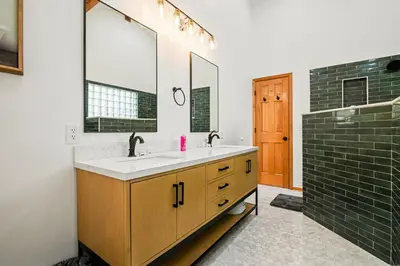 a bathroom with a sink and a mirror and a shower at 226 E Shore Dr in East Stroudsburg