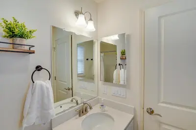 a bathroom with a sink and a mirror at Sleepy Hollow Lake Home with Deck, Pool Access! in Athens