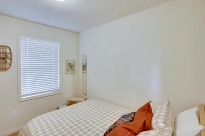a bedroom with a bed and a window at Sleepy Hollow Lake Home with Deck, Pool Access! in Athens