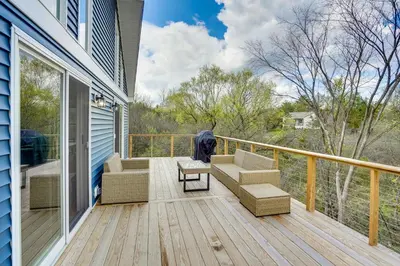 a porch with a couch and chairs on a deck at Sleepy Hollow Lake Home with Deck, Pool Access! in Athens