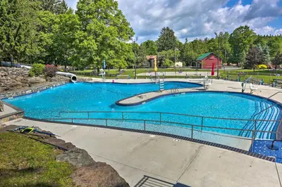 a large swimming pool with blue water in a park at Walk to Lake Wallenpaupack Poconos Vacation Home in Lake Ariel