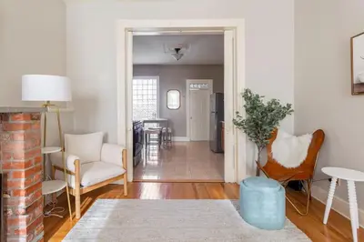 a living room with a couch chairs and a table at The Matisse at Wooster Square Yale With Parking in New Haven